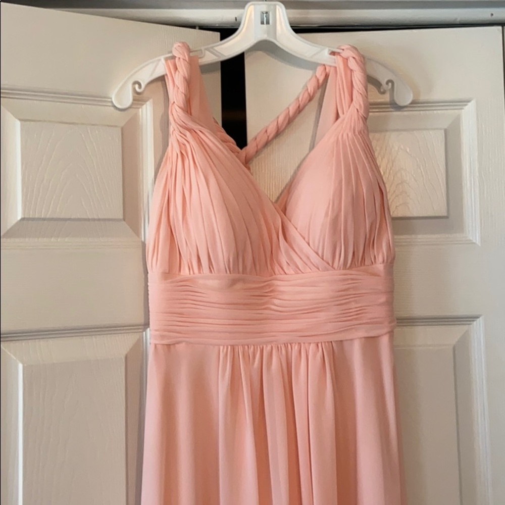 Long pink bridesmaid dress.